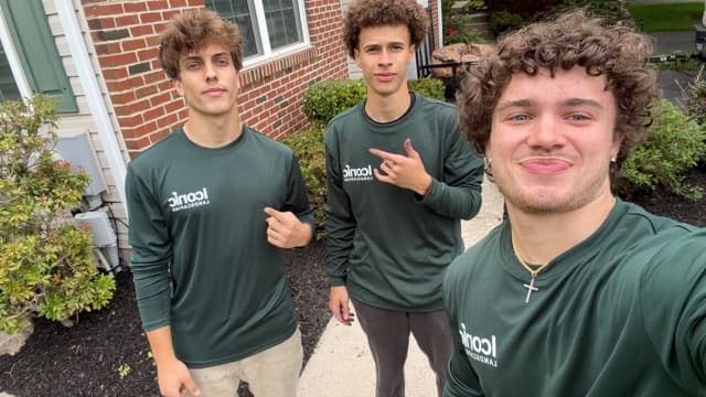 Iconic Landscaping crew wearing team merch